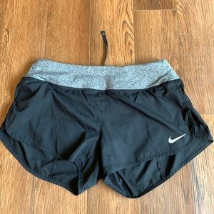 Black Nike running shorts